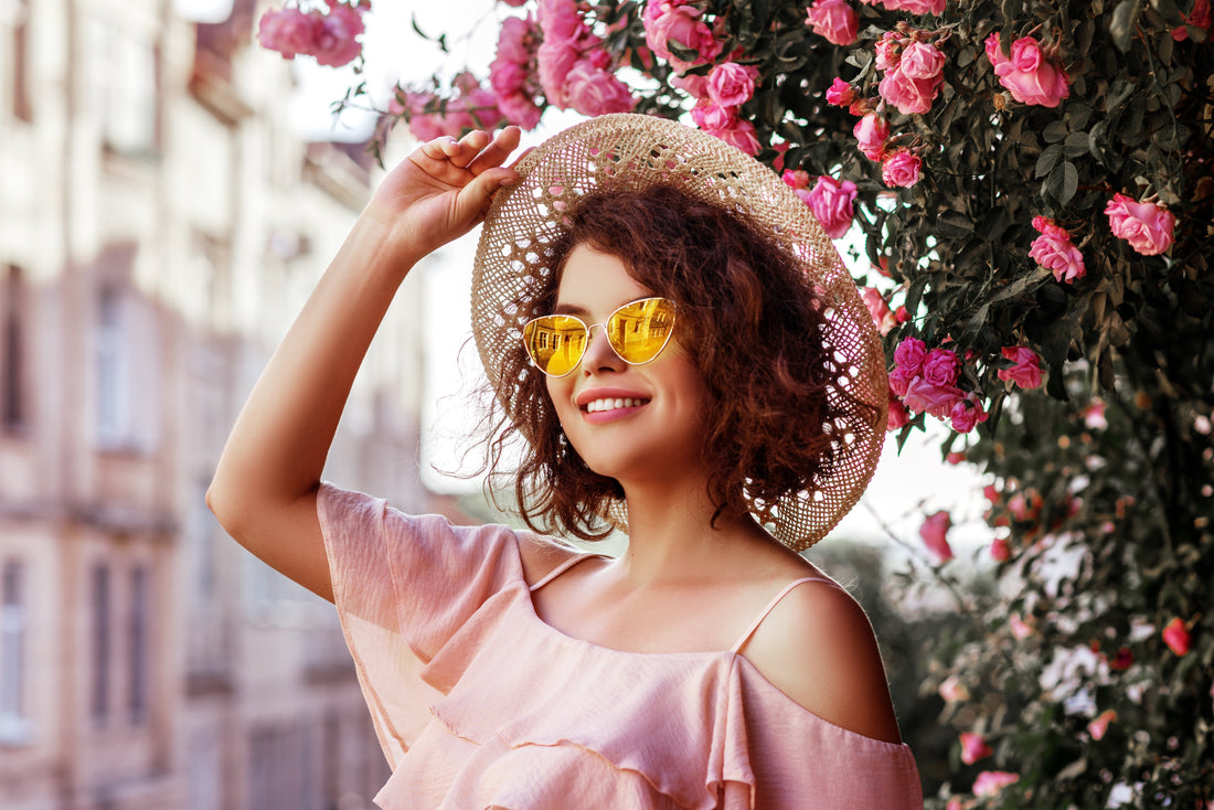 woman in hat and sunnies