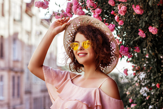 woman in hat and sunnies