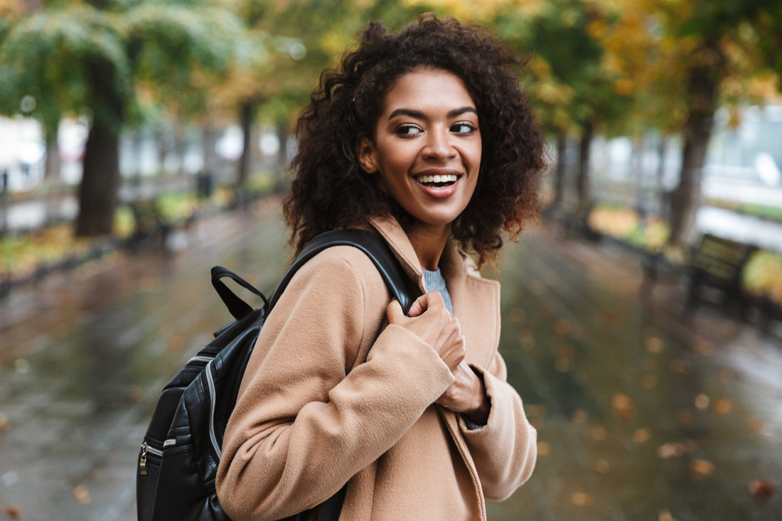 College student with fall jacket and backpack