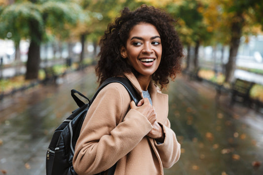 College student with fall jacket and backpack
